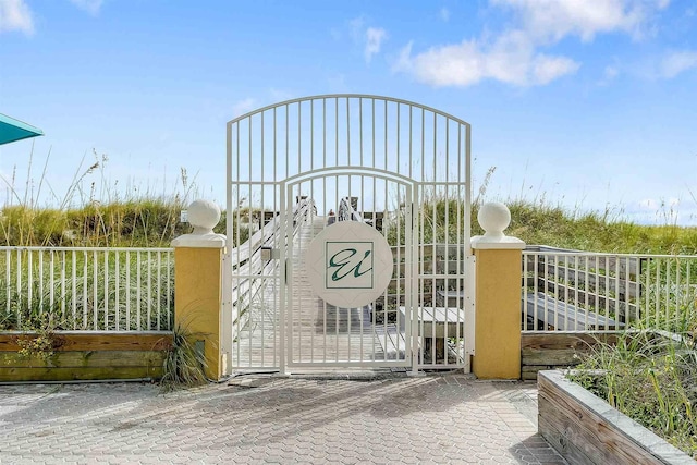 view of gate featuring fence