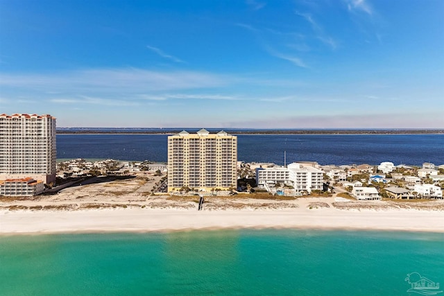 drone / aerial view featuring a view of the beach and a water view