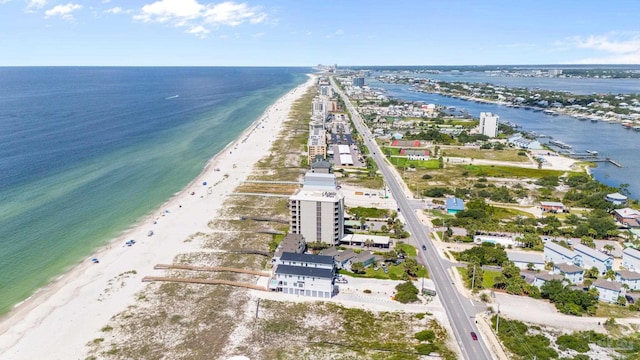 bird's eye view featuring a view of the beach and a water view