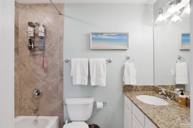 full bathroom with tiled shower / bath combo, vanity, and toilet