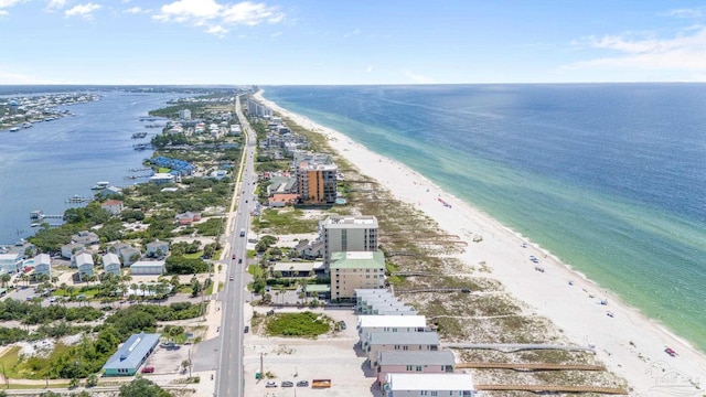 bird's eye view featuring a water view and a view of the beach