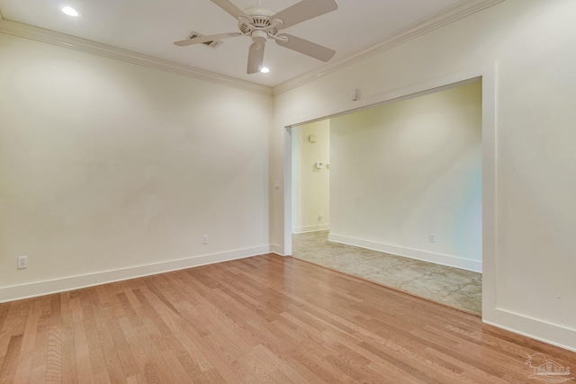 spare room featuring light hardwood / wood-style floors, ceiling fan, and crown molding