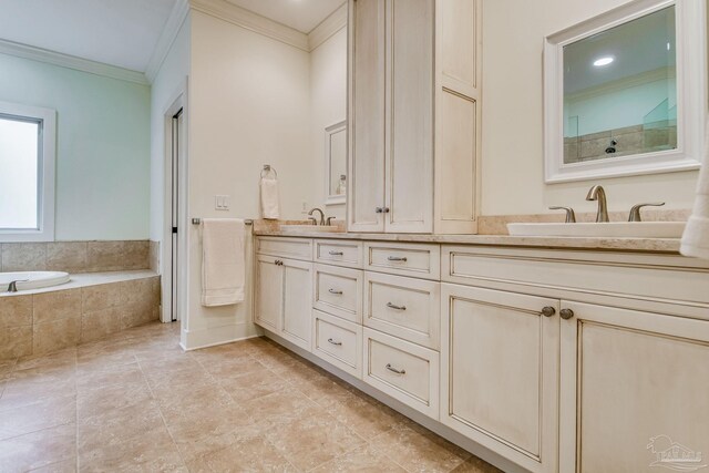 bathroom featuring tiled bath, crown molding, and vanity