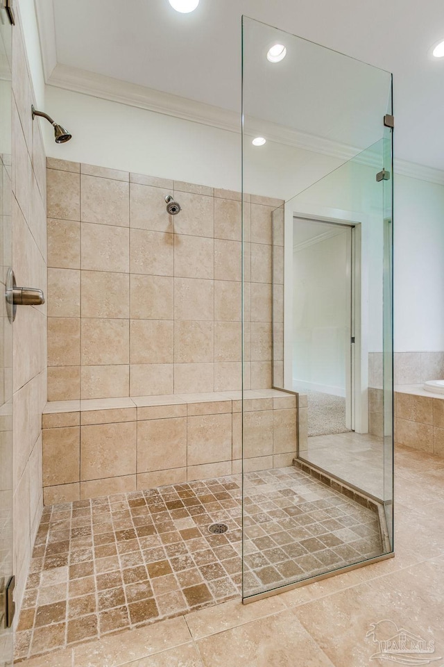 bathroom featuring tile patterned flooring, ornamental molding, and plus walk in shower