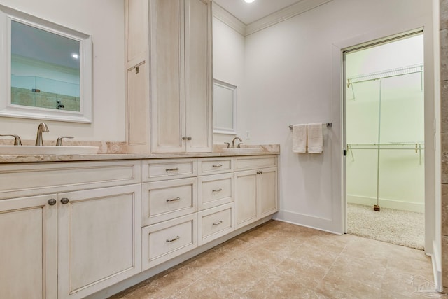 bathroom with crown molding and vanity