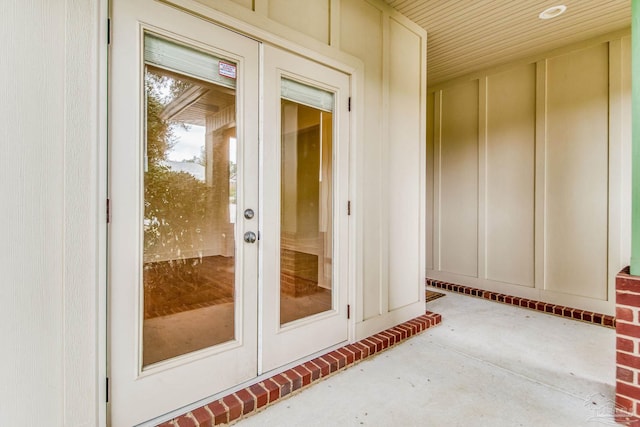 view of exterior entry featuring french doors