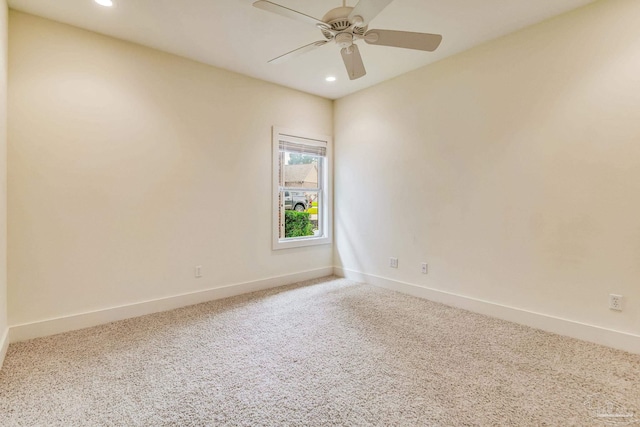 unfurnished room with carpet and ceiling fan