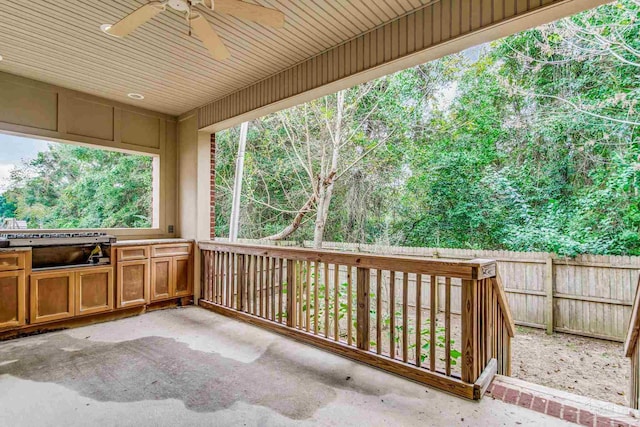 view of patio with an outdoor kitchen and ceiling fan