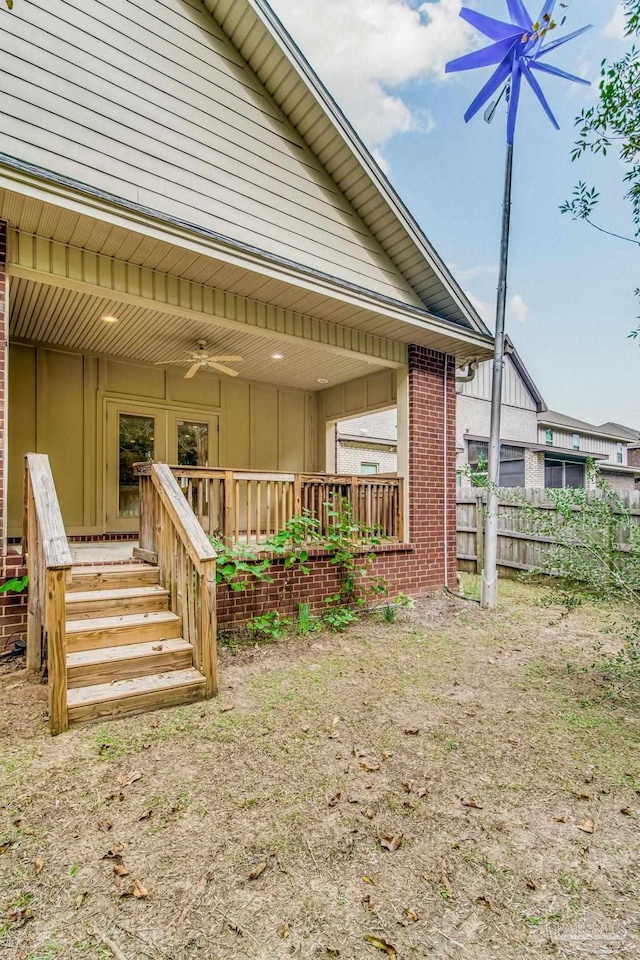 exterior space with ceiling fan