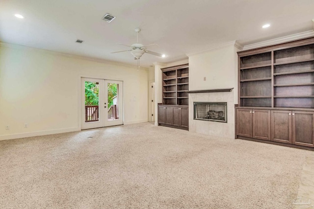 unfurnished living room featuring ceiling fan, crown molding, and french doors