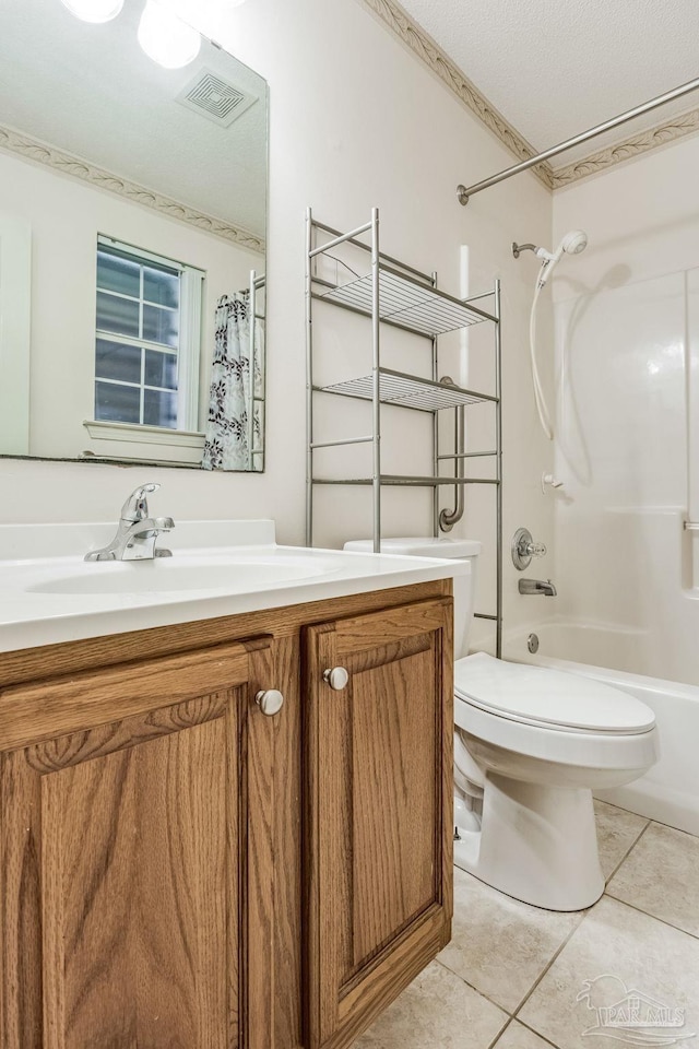 full bathroom featuring tile patterned flooring, vanity, shower / bathtub combination, and toilet