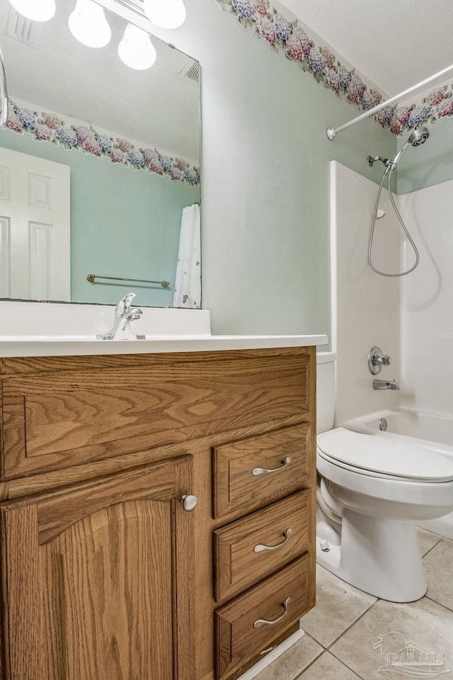 full bathroom with tile patterned flooring, vanity, shower / bathtub combination, and toilet