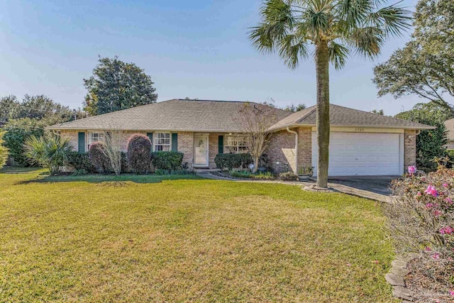 single story home featuring a front lawn and a garage