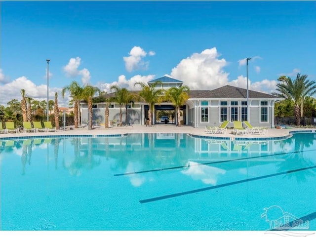 view of swimming pool with a patio area