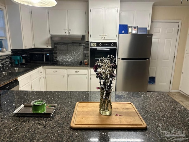 kitchen featuring sink, white cabinets, backsplash, tile patterned flooring, and black appliances