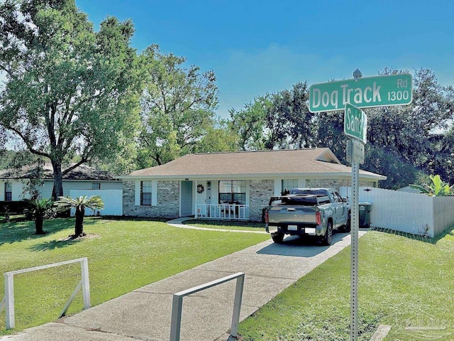 single story home featuring a porch and a front yard