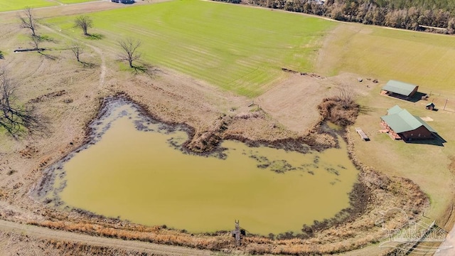 birds eye view of property featuring a water view and a rural view