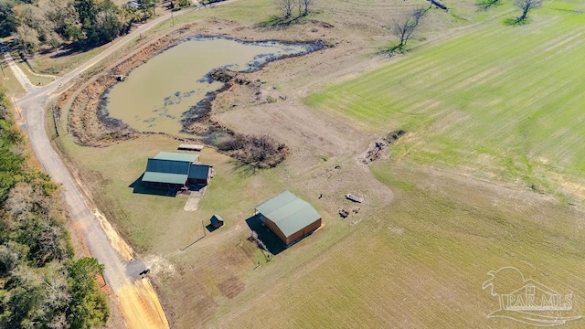 aerial view with a rural view and a water view