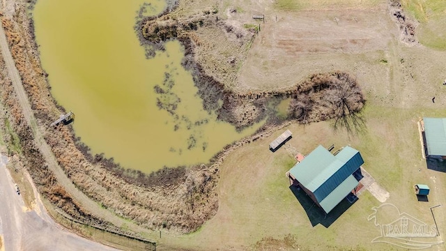 birds eye view of property with a water view