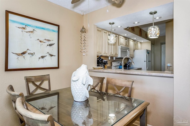 dining space featuring a ceiling fan