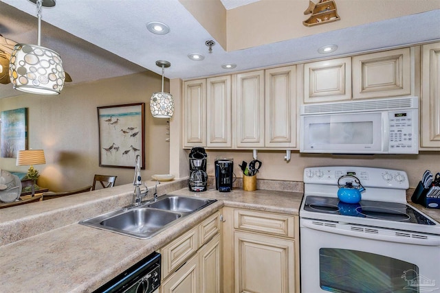 kitchen featuring a sink, cream cabinetry, recessed lighting, decorative light fixtures, and white appliances