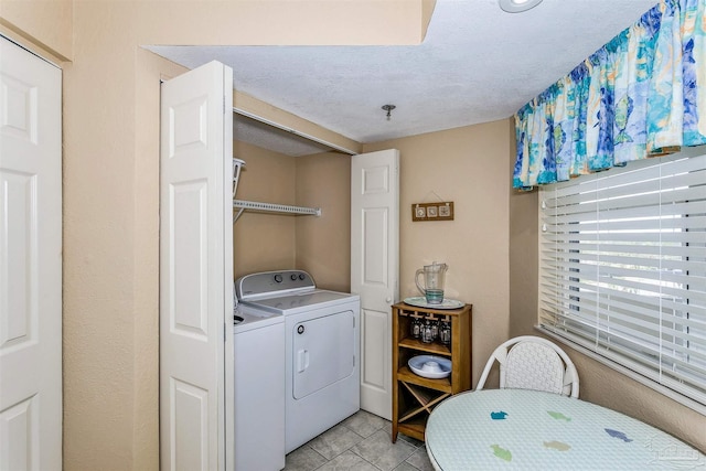 laundry room featuring independent washer and dryer and laundry area