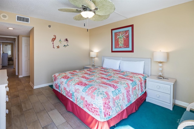 13753 Perdido Key Dr Unit 608, Pensacola, FL 32507 - bedroom featuring baseboards, a ceiling fan, visible vents, and wood finished floors