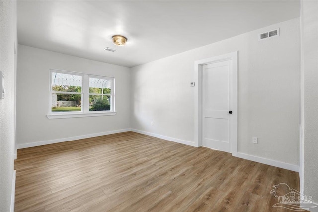 empty room with light hardwood / wood-style floors