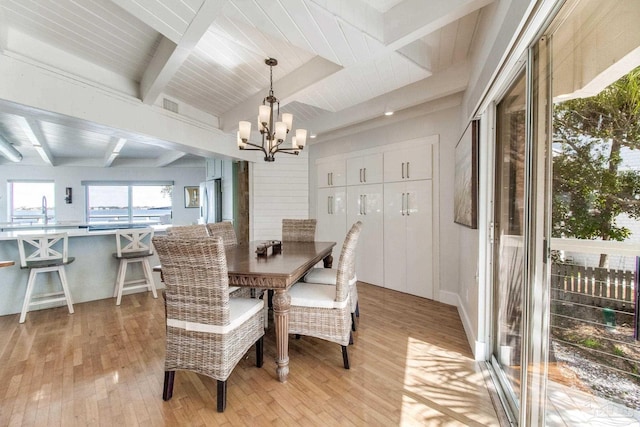 dining room featuring an inviting chandelier, light wood-style floors, wooden ceiling, and beam ceiling