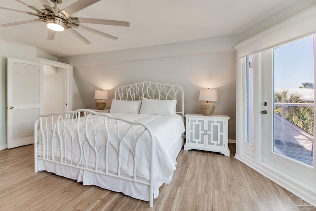 bedroom with a ceiling fan, light wood-style floors, and access to outside