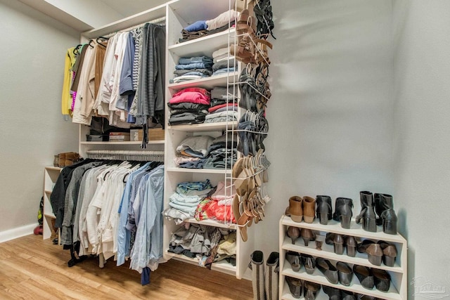 spacious closet with wood finished floors