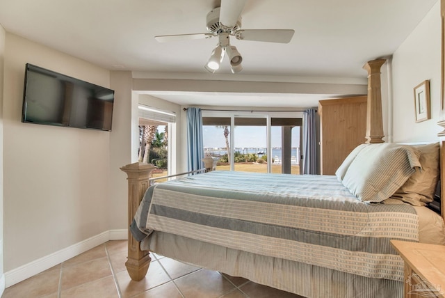 bedroom with access to exterior, light tile patterned flooring, a ceiling fan, and baseboards