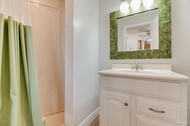 bathroom with ceiling fan and vanity