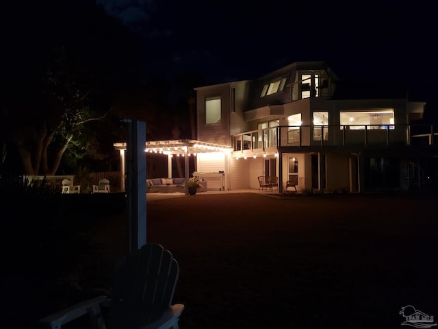 view of front of property with a patio area and a pergola