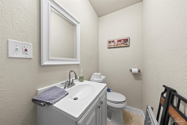 5607 Fairview Dr, Pensacola, FL 32505 - bathroom featuring vanity, toilet, and a textured wall