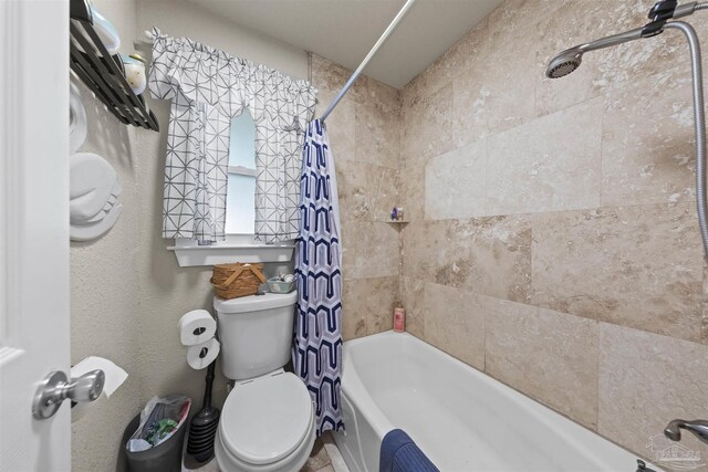5607 Fairview Dr, Pensacola, FL 32505 - bathroom featuring shower / tub combo and toilet