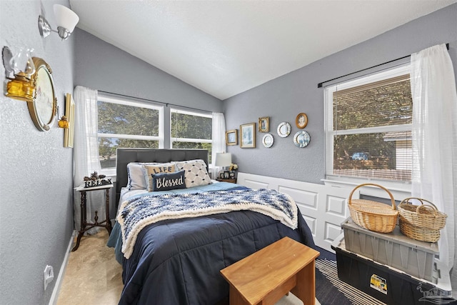 5607 Fairview Dr, Pensacola, FL 32505 - bedroom with a textured wall, vaulted ceiling, and carpet floors