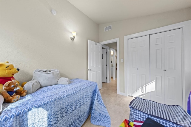 5607 Fairview Dr, Pensacola, FL 32505 - bedroom featuring light tile patterned floors, a closet, and baseboards