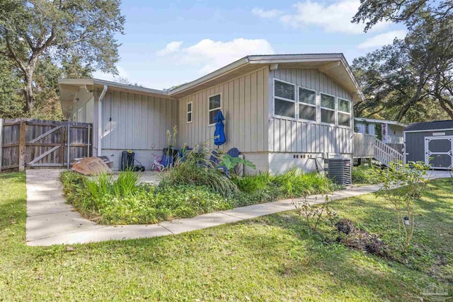 5607 Fairview Dr, Pensacola, FL 32505 - view of front of house featuring cooling unit and board and batten siding