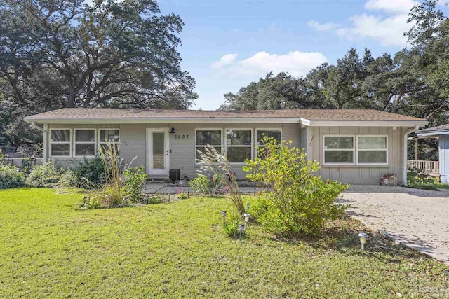 5607 Fairview Dr, Pensacola, FL 32505 - single story home with a front yard and board and batten siding