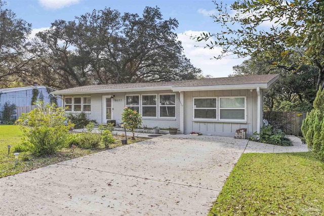 5607 Fairview Dr, Pensacola, FL 32505 - single story home with board and batten siding, brick siding, and concrete driveway