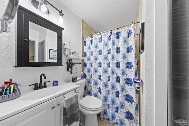 5607 Fairview Dr, Pensacola, FL 32505 - bathroom with toilet, vanity, a textured wall, a textured ceiling, and a shower with shower curtain