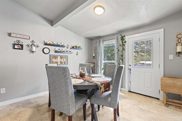 5607 Fairview Dr, Pensacola, FL 32505 - dining area with a textured wall, baseboards, and a textured ceiling