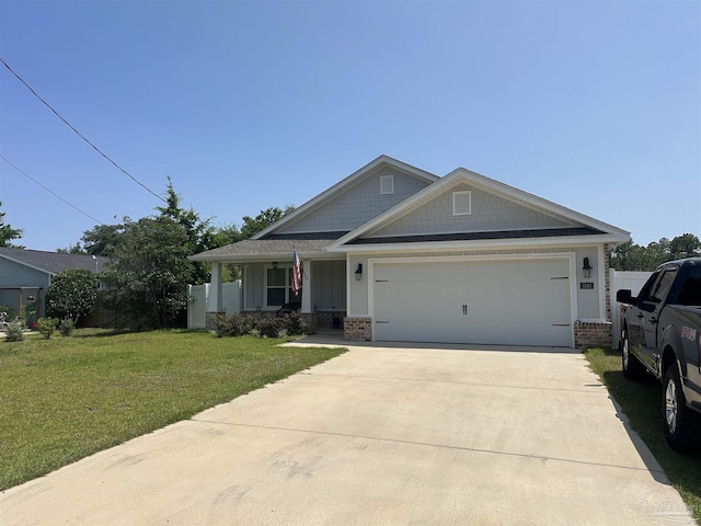 5343 Boots Byars Ct, Gulf Breeze, FL 32563 - craftsman house featuring brick siding, a front yard, concrete driveway, and an attached garage