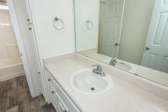 bathroom featuring hardwood / wood-style flooring and vanity