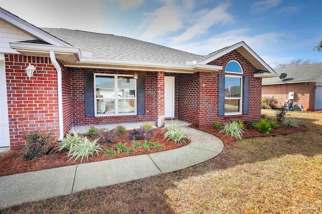 ranch-style home with a front yard