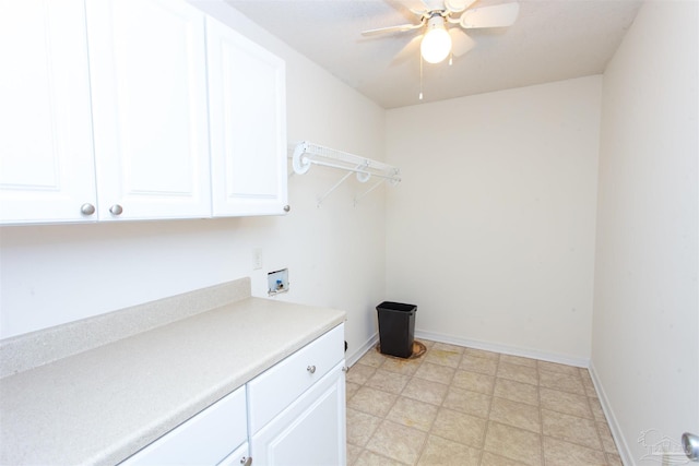 clothes washing area featuring ceiling fan, cabinets, and washer hookup