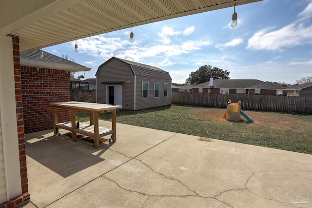 view of patio featuring a storage unit