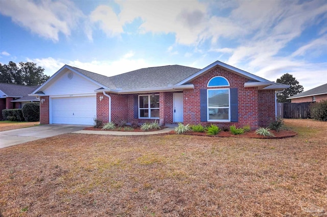 single story home with a garage and a front lawn