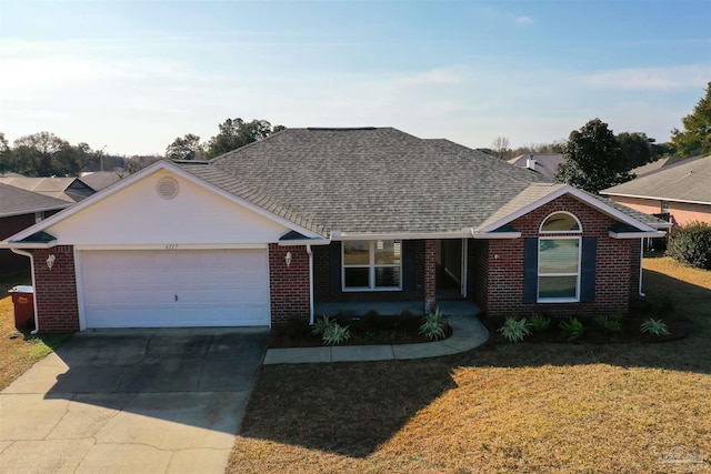 ranch-style house with a garage and a front lawn